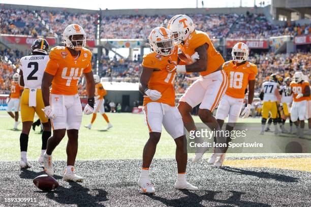 Tennessee Volunteers defensive back Andre Turrentine celebrates an interception with teammates during the game between the Tennessee Volunteers and...