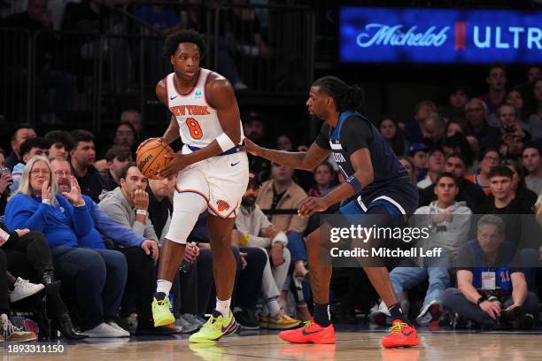 Anunoby of the New York Knicks controls the ball against Naz Reid of the Minnesota Timberwolves in the first half at Madison Square Garden on January...