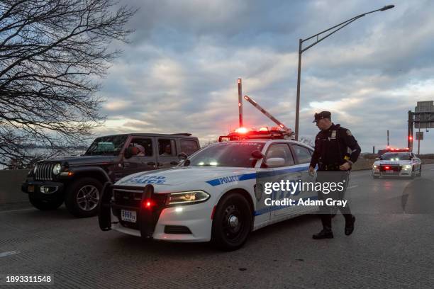 New York Police Department officers stop a vehicle containing supporters of Palestine near LaGuardia Airport as people targeted JFK and LaGuardia...