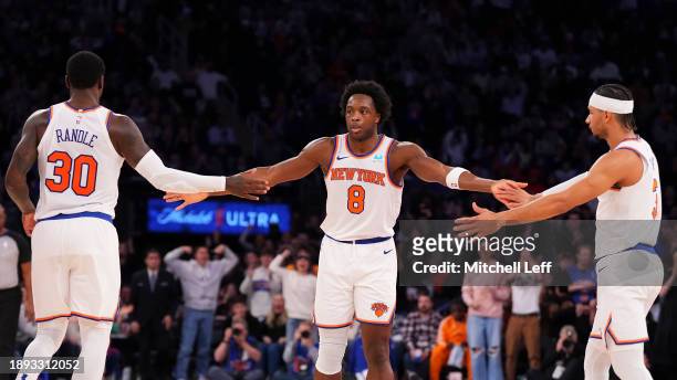 Anunoby of the New York Knicks celebrates with Julius Randle and Josh Hart against the Minnesota Timberwolves in the second half at Madison Square...