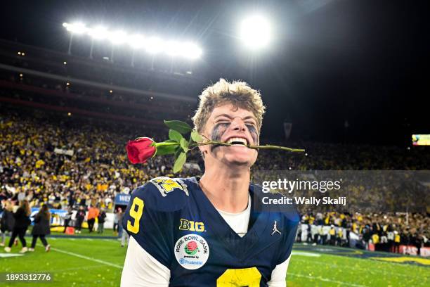 Michigan Wolverines quarterback J.J. McCarthy celebrates after defeating Alabama 27-20 in overtime of the College Football Playoff semifinals hosted...