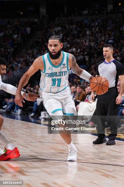 Cody Martin of the Charlotte Hornets handles the ball during the game against the Denver Nuggets on January 1, 2024 at the Ball Arena in Denver,...