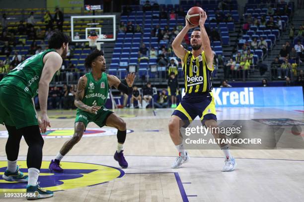 Istanbul, Turkey. Melih Mahmutoglu, #10 of Fenerbahce Beko Istanbul in action against Jordan Floyd, #4 and Ahmet Can Duran, #14 of Bursaspor Info...