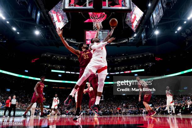 Barrett of the Toronto Raptors goes to the basket against Jarrett Allen of the Cleveland Cavaliers during the first half of their basketball game at...