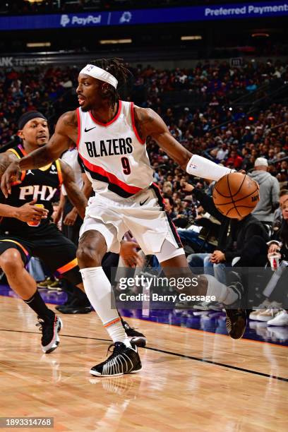 Jerami Grant of the Portland Trail Blazers handles the ball during the game against the Phoenix Suns on January 1, 2024 at Footprint Center in...