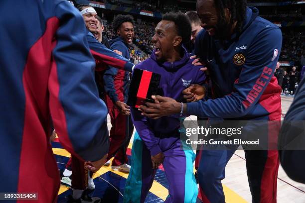 Ish Smith of the Charlotte Hornets receives his Championship Ring before the game against the Denver Nuggets on January 1, 2024 at the Ball Arena in...