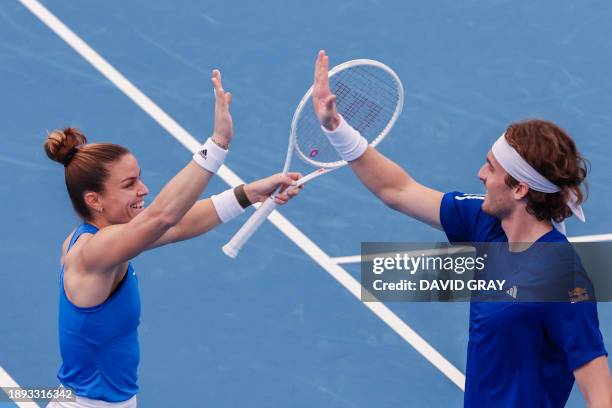 Greece's Stefanos Tsitsipas and Maria Sakkari react during their mixed-doubles match against Chile's Tomas Barrios Vera and Daniela Seguel at the...