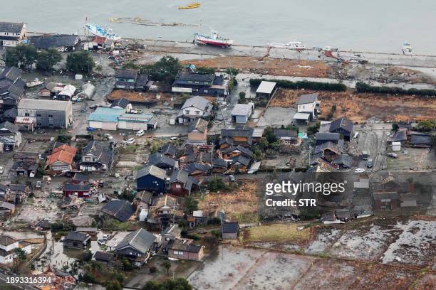 This aerial photo provided by Jiji Press shows damage in the city of Suzu, Ishikawa prefecture on January 2 a day after a major 7.5 magnitude...
