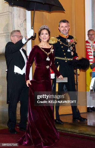Denmark's future king and queen, Crown Prince Frederik and Crown Princess Mary pose as they arrive for the New Year's banquet at Amalienborg Castle,...