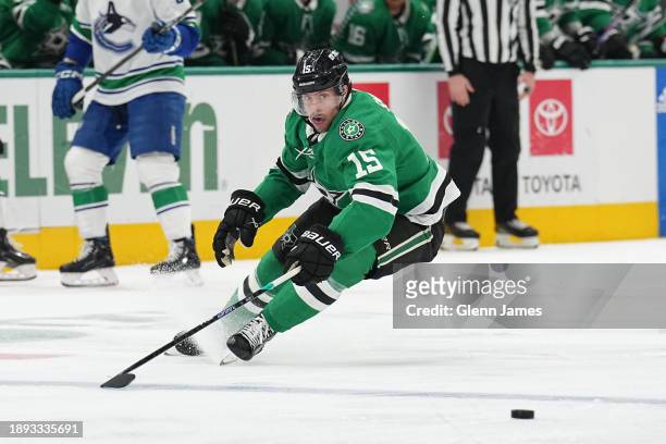 Craig Smith of the Dallas Stars handles the puck against the Vancouver Canucks at the American Airlines Center on December 21, 2023 in Dallas, Texas.