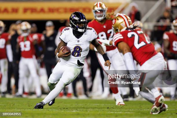 Lamar Jackson of the Baltimore Ravens runs the ball as he scrambles during an NFL football game against the San Francisco 49ers at Levi's Stadium on...