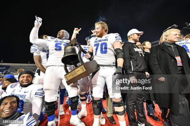 Memphis Tigers players celebrate after the 2023 AutoZone Liberty Bowl against the Iowa State Cyclones at Simmons Bank Liberty Stadium on December 29,...