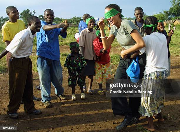 United Nations High Commissioner for Refugees Goodwill Ambassador Angelina Jolie helps to build a hut for newly arrived unaccompanied minors on March...