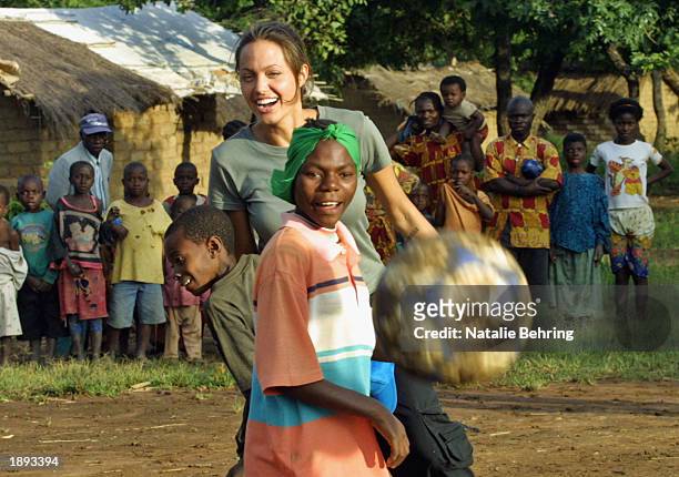 United Nations High Commissioner for Refugees Goodwill Ambassador Angelina Jolie helps to build a hut for newly arrived unaccompanied minors on March...