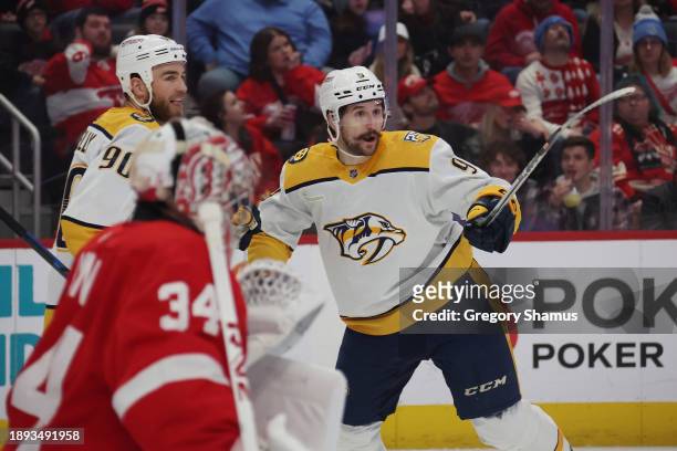 Filip Forsberg of the Nashville Predators celebrates his first period goal with Ryan O'Reilly in front of Alex Lyon of the Detroit Red Wings at...