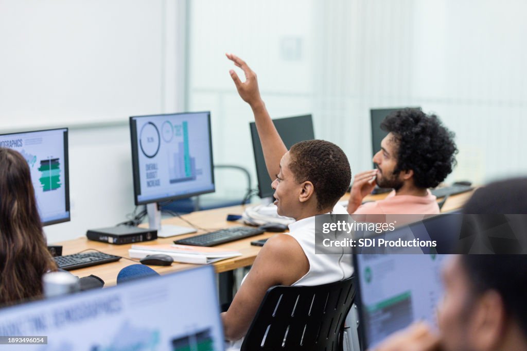 During class in computer lab, female student asks question