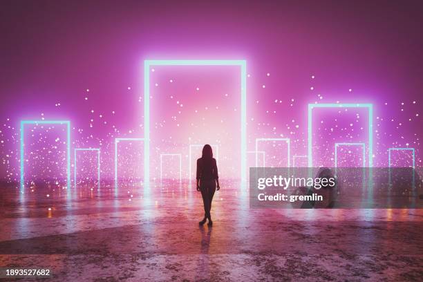 donna in piedi davanti a portali luminosi - door foto e immagini stock