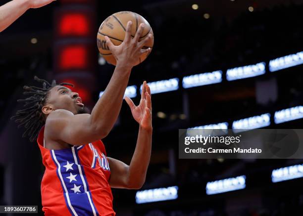 Tyrese Maxey of the Philadelphia 76ers drives to the net ahead of Alperen Sengun of the Houston Rockets during the first half at Toyota Center on...