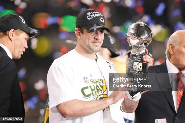 Aaron Rodgers of the Green Bay Packers holds the Vince Lombardi Trophy after defeating the Pittsburgh Steelers during Super Bowl XLV at Cowboys...
