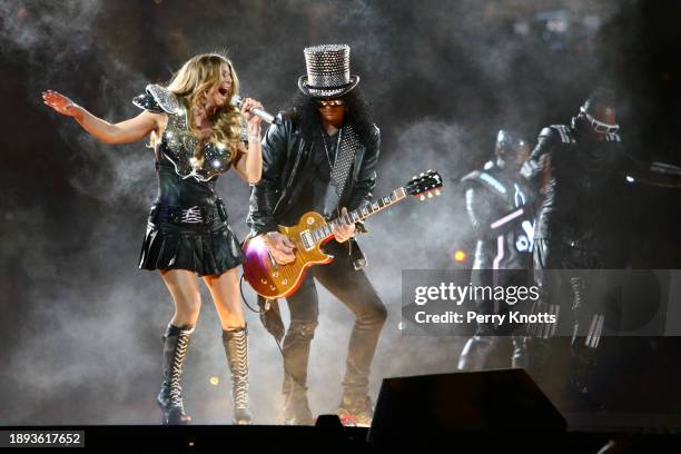 Fergie of the Black Eyed Peas and Slash of Guns N' Roses preform during Super Bowl XLV game between the Pittsburgh Steelers and the Green Bay Packers...