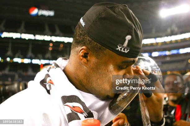 Raji of the Green Bay Packers kisses the Vince Lombardi Trophy after defeating the Pittsburgh Steelers during Super Bowl XLV at Cowboys Stadium on...