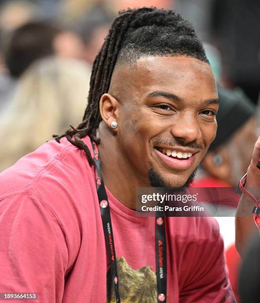 Player Bijan Robinson attends the game between the Sacramento Kings and the Atlanta Hawks at State Farm Arena on December 29, 2023 in Atlanta,...