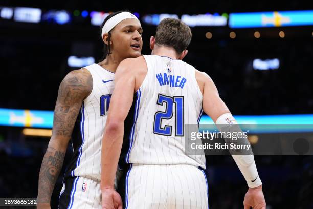 Paolo Banchero and Moritz Wagner of the Orlando Magic celebrate after scoring against the New York Knicks during the fourth quarter at Kia Center on...