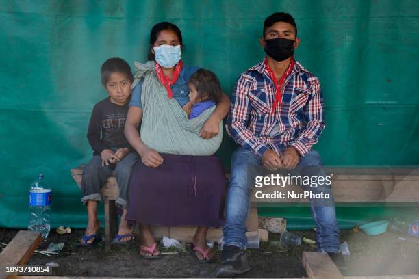 Family is posing for the 30th Anniversary celebrations of the Zapatista Army of National Liberation uprising, held at El Caracol Rebeldia y...