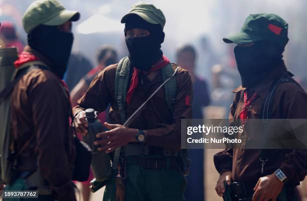 Members of the Zapatista Army of National Liberation are walking in the area known as El Caracol Rebeldia y Resistencia in the mountains of southeast...