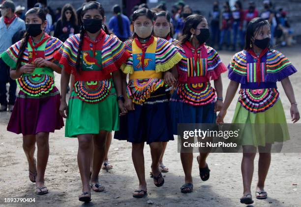 Members of the Zapatista Army of National Liberation are walking in the area known as El Caracol Rebeldia y Resistencia in the mountains of southeast...