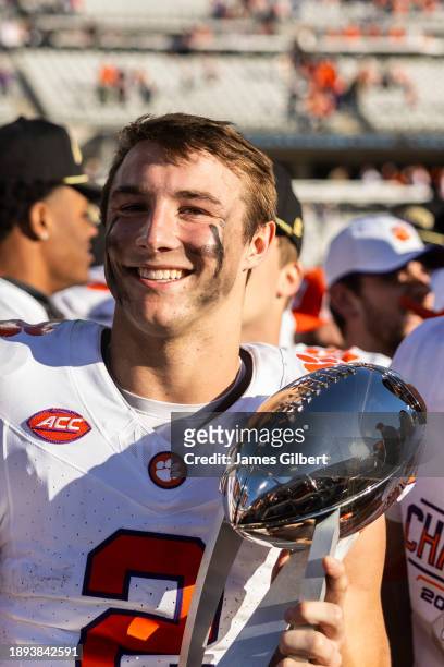 Cade Klubnik of the Clemson Tigers holds the Ash Verlander Champions Trophy after defeating the Kentucky Wildcats 38-35 in the TaxSlayer Gator Bowl...