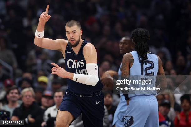 Ivica Zubac of the LA Clippers reacts after scoring during the first half of a game against the Memphis Grizzlies at Crypto.com Arena on December 29,...