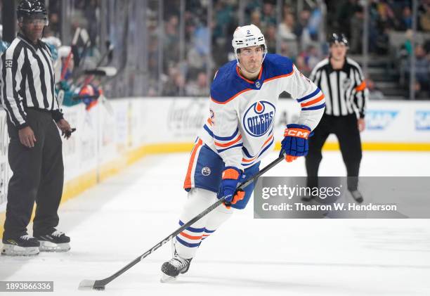 Evan Bouchard of the Edmonton Oilers skates with control of the puck against the San Jose Sharks during the first period of an NHL hockey game at SAP...