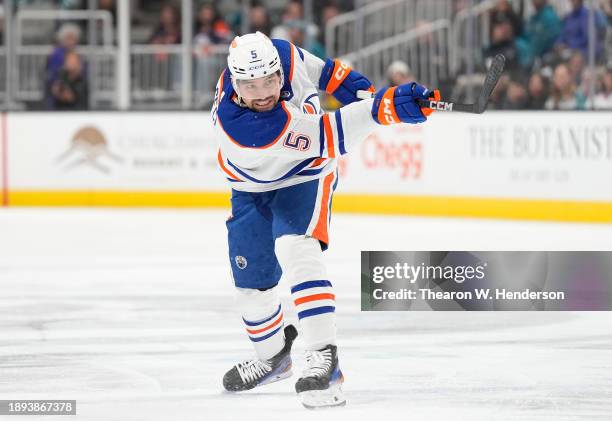 Cody Ceci of the Edmonton Oilers shoots on goal against the San Jose Sharks during the first period of an NHL hockey game at SAP Center on December...