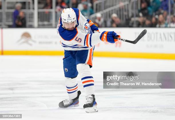 Cody Ceci of the Edmonton Oilers shoots on goal against the San Jose Sharks during the first period of an NHL hockey game at SAP Center on December...