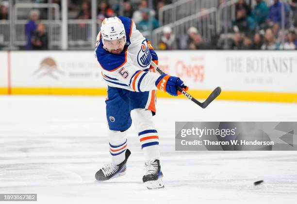 Cody Ceci of the Edmonton Oilers shoots on goal against the San Jose Sharks during the first period of an NHL hockey game at SAP Center on December...