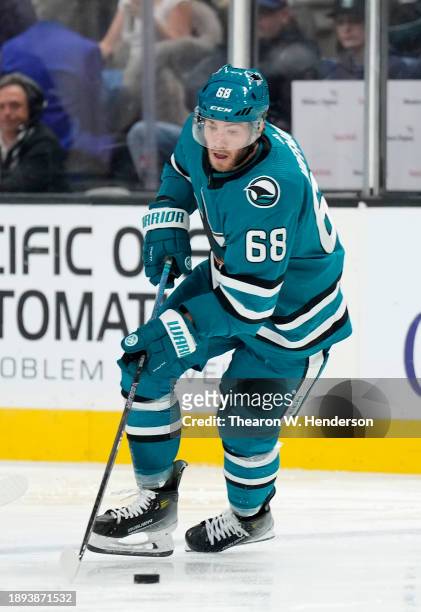 Mike Hoffman of the San Jose Sharks skates with control of the puck against the Edmonton Oilers during the third period of an NHL hockey game at SAP...