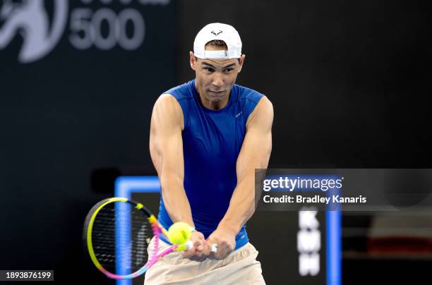 Rafael Nadal plays a shot during a practice match against Andy Murray ahead of the 2024 Brisbane International at Queensland Tennis Centre on...