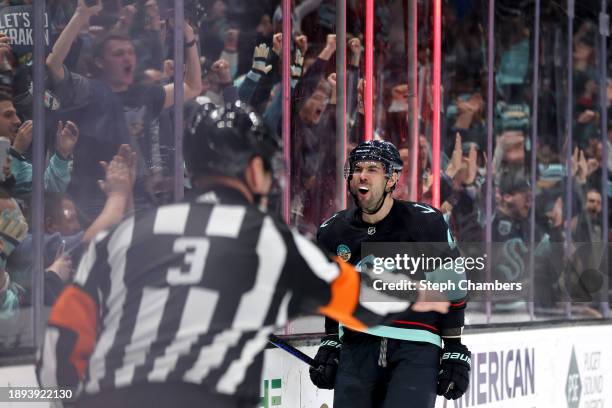 Justin Schultz of the Seattle Kraken celebrates his game-winning goal in overtime against the Philadelphia Flyers at Climate Pledge Arena on December...