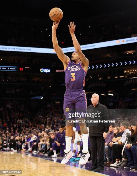 Bradley Beal of the Phoenix Suns attempts a three-point shot against the Charlotte Hornets during the first half of the NBA game at Footprint Center...