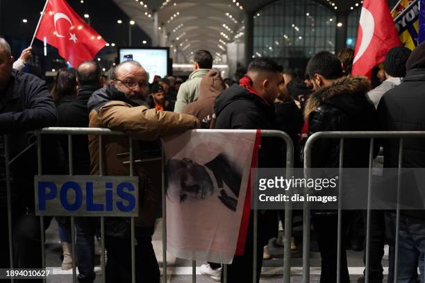 People gather as the Galatasaray football club returns at Istanbul Airport on December 30, 2023 in Istanbul, Turkey. The team arrived from Riyadh...