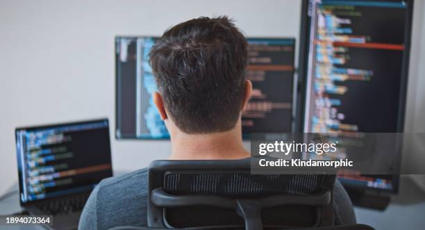 american male software engineer developer use laptop computer at home office, work on application program coding. programming language development technology, freelance work from home, rear view - software development stock pictures, royalty-free photos & images