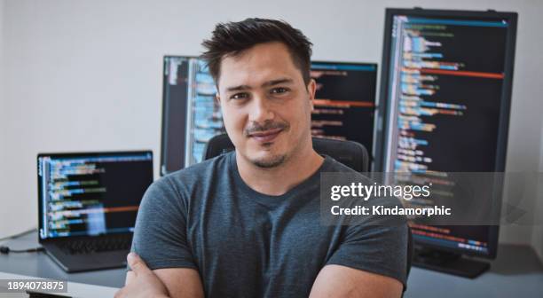 portrait of american male software engineer developer arms crossed, smiling at home office, work on application program coding. programming language development technology, freelance work from home - software development stock pictures, royalty-free photos & images