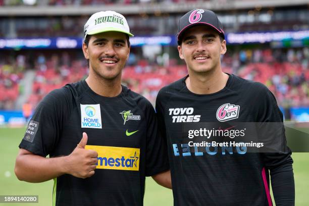 Ollie Davies of the Thunder and brother Joel Davies of the Sixers pose for a photo ahead of the the BBL match between Sydney Thunder and Sydney...