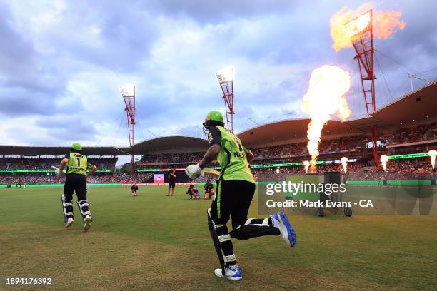 Cameron Bancroft and Alex Hales of the Thunder take to the field during the BBL match between Sydney Thunder and Sydney Sixers at GIANTS Stadium, on...