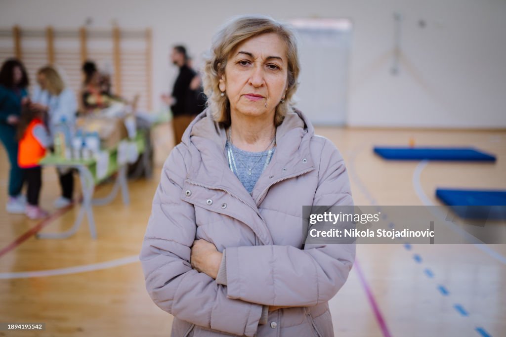 Refugee looking at camera in refugee camp