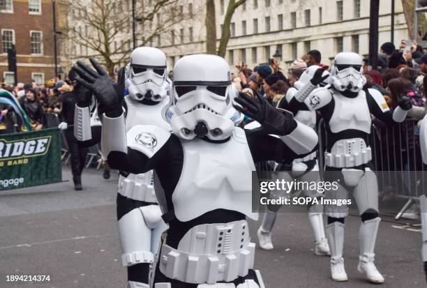 Participants wearing Star Wars Stormtroopers costumes pass through Whitehall during London's New Year's Day Parade.