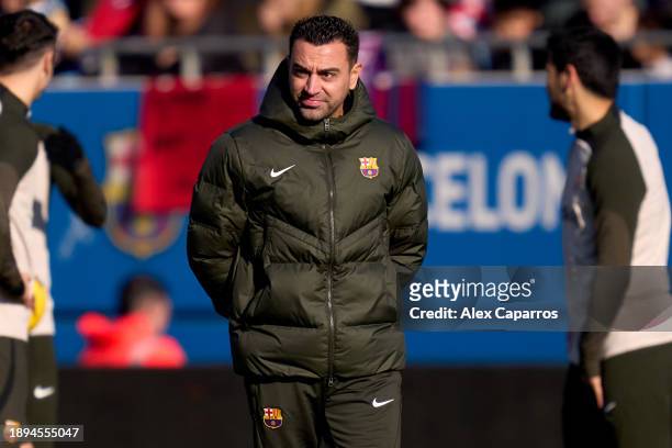 Head Coach Xavi Hernandez of FC Barcelona looks on during a FC Barcelona open doors training session at Estadi Johan Cruyff on December 30, 2023 in...