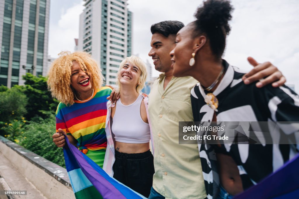 Young lgbtqia+ friends talking outdoors