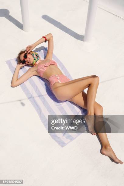 Lisa Marie Fernandez’s nylon, polyester and elastane jacquard bikini. Echo scarf; Prada at Sunglass Hut sunglasses; Tuza bracelet and ring...Swimsuit...